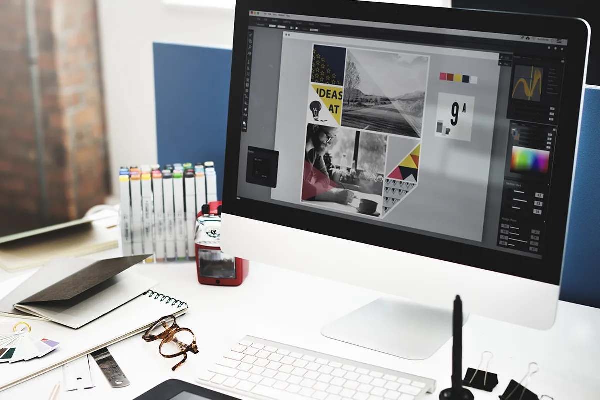Lavoro grafico su computer per sviluppo branding e contenuti visivi
